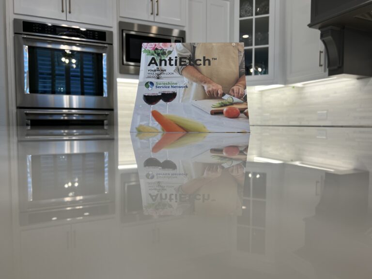 UV-cured MORE® AntiEtch® coating being applied to marble countertop in a luxury Bel Air kitchen to prevent etching and staining