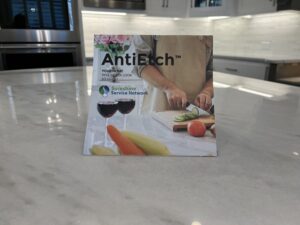 Marble kitchen countertop protected with MORE® AntiEtch®, showing a clean, even finish designed to resist etching and staining from acidic spills while preserving the stone’s natural veining.