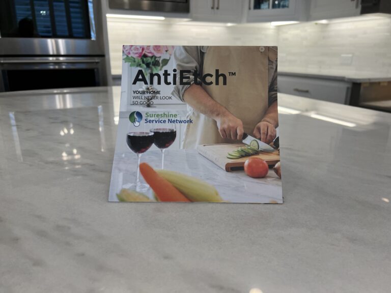 Marble kitchen countertop protected with MORE® AntiEtch®, showing a clean, even finish designed to resist etching and staining from acidic spills while preserving the stone’s natural veining.