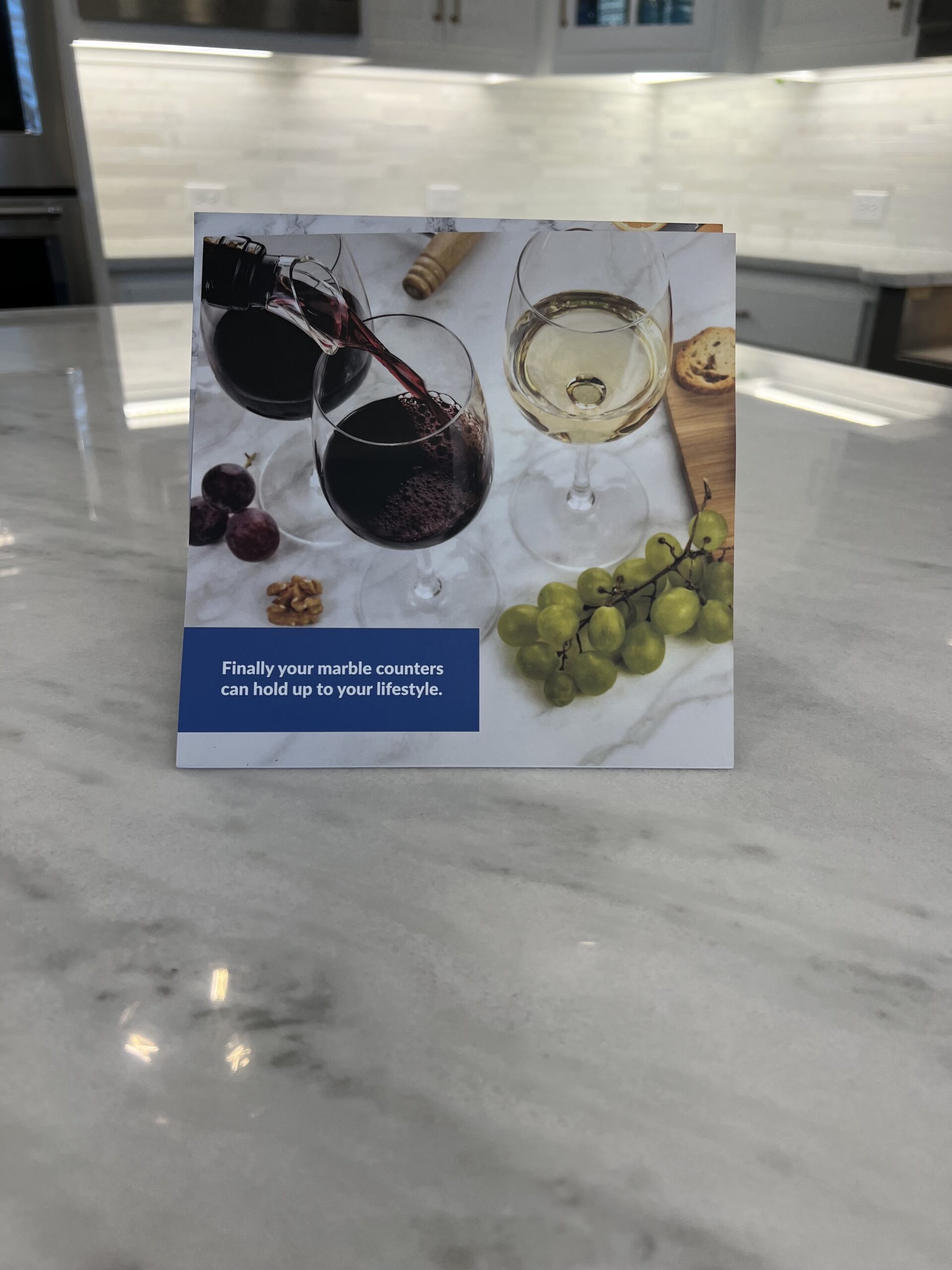 Technician applying MORE® AntiEtch® to a marble kitchen countertop, creating a clear protective barrier to help prevent etching and staining while preserving the natural stone finish.