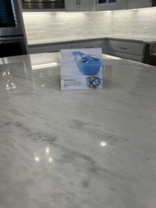 Close-up of a marble kitchen countertop protected with MORE® AntiEtch®, showing a clean, natural stone appearance designed to help resist etching and staining from everyday kitchen use.