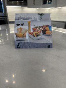 A polished marble kitchen island in a Pacific Palisades home protected with MORE® AntiEtch®, reflecting natural light and free of etches or stains.