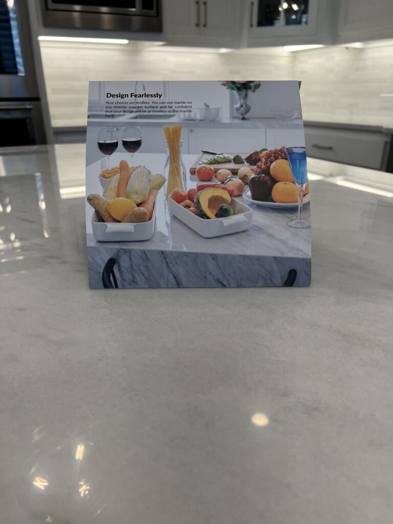 A polished marble kitchen island in a Pacific Palisades home protected with MORE® AntiEtch®, reflecting natural light and free of etches or stains.