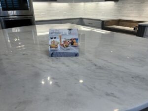 MORE AntiEtch marble countertop protection in Newport Beach CA showing acid resistance on kitchen island surface