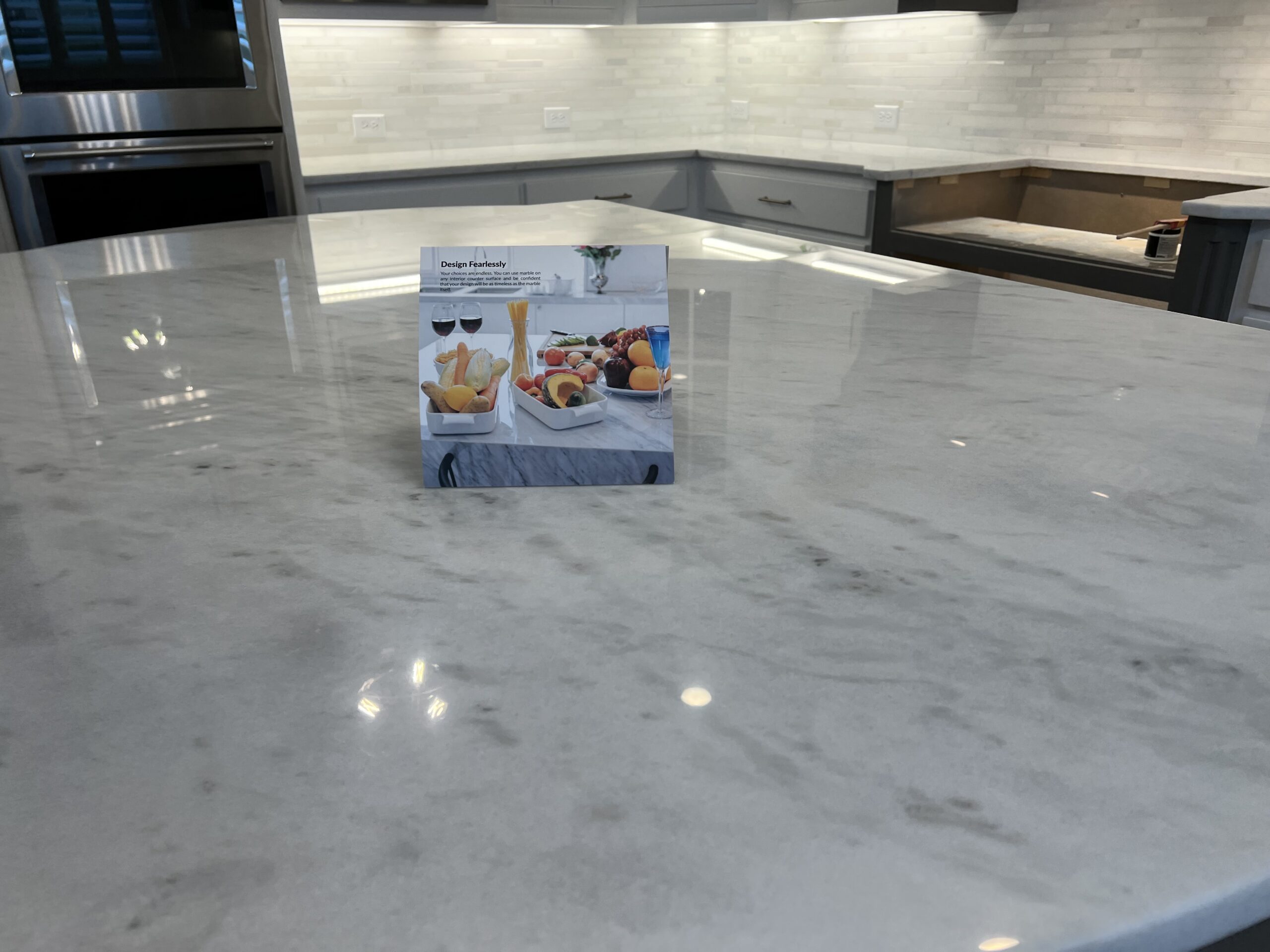 MORE AntiEtch marble countertop protection in Newport Beach CA showing acid resistance on kitchen island surface