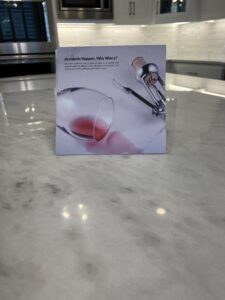 Marble countertop showing dull etch marks caused by acidic foods before restoration in Frisco Texas.