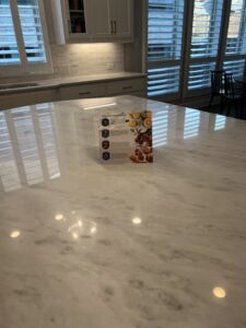 Close-up of a polished marble countertop protected with MORE® AntiEtch® coating in a luxury Henderson, NV kitchen