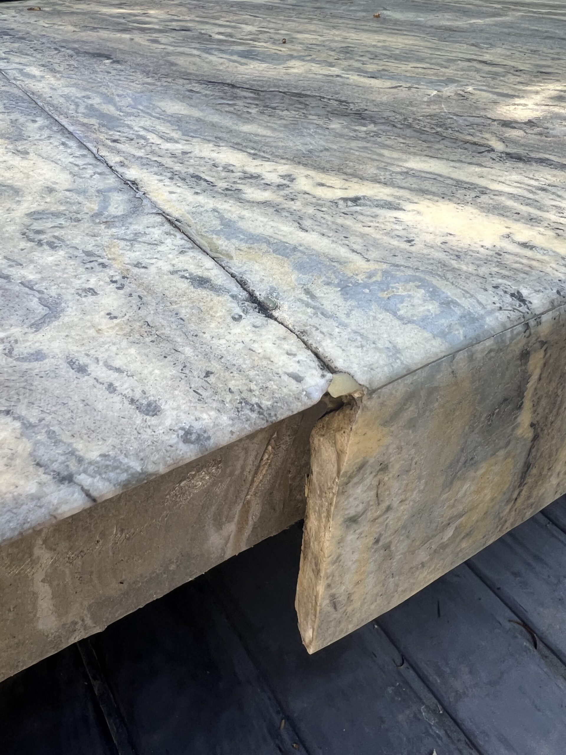 Close-up of granite sink rail crack being professionally repaired by Sureshine technician in a Laguna Beach kitchen.