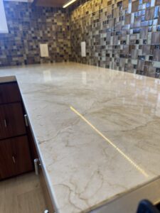 marble floor polishing in Brentwood CA showing before and after restoration with improved shine and reflection