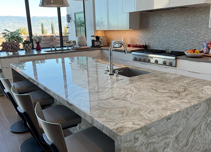 Professionally sealed natural stone kitchen island in a luxury Newport Beach home, protected by Sureshine Care and Restoration Services, Inc.