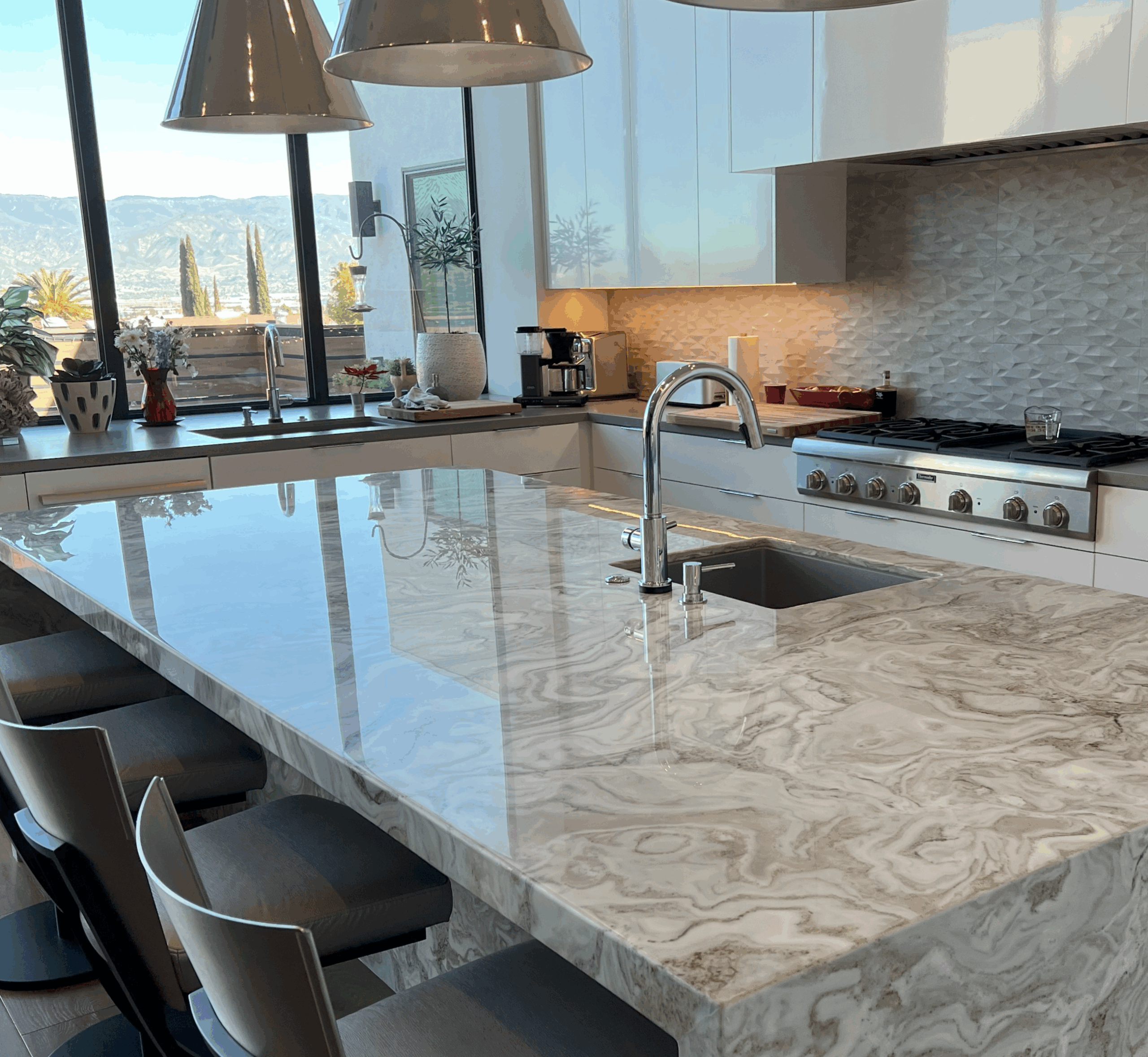 Technician polishing a marble countertop in a Highland Park home to restore its natural shine and reflection.