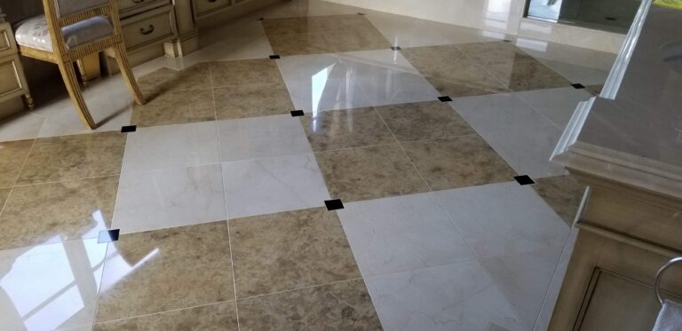 Technician polishing a marble floor in a luxury Plano home, restoring its high gloss finish