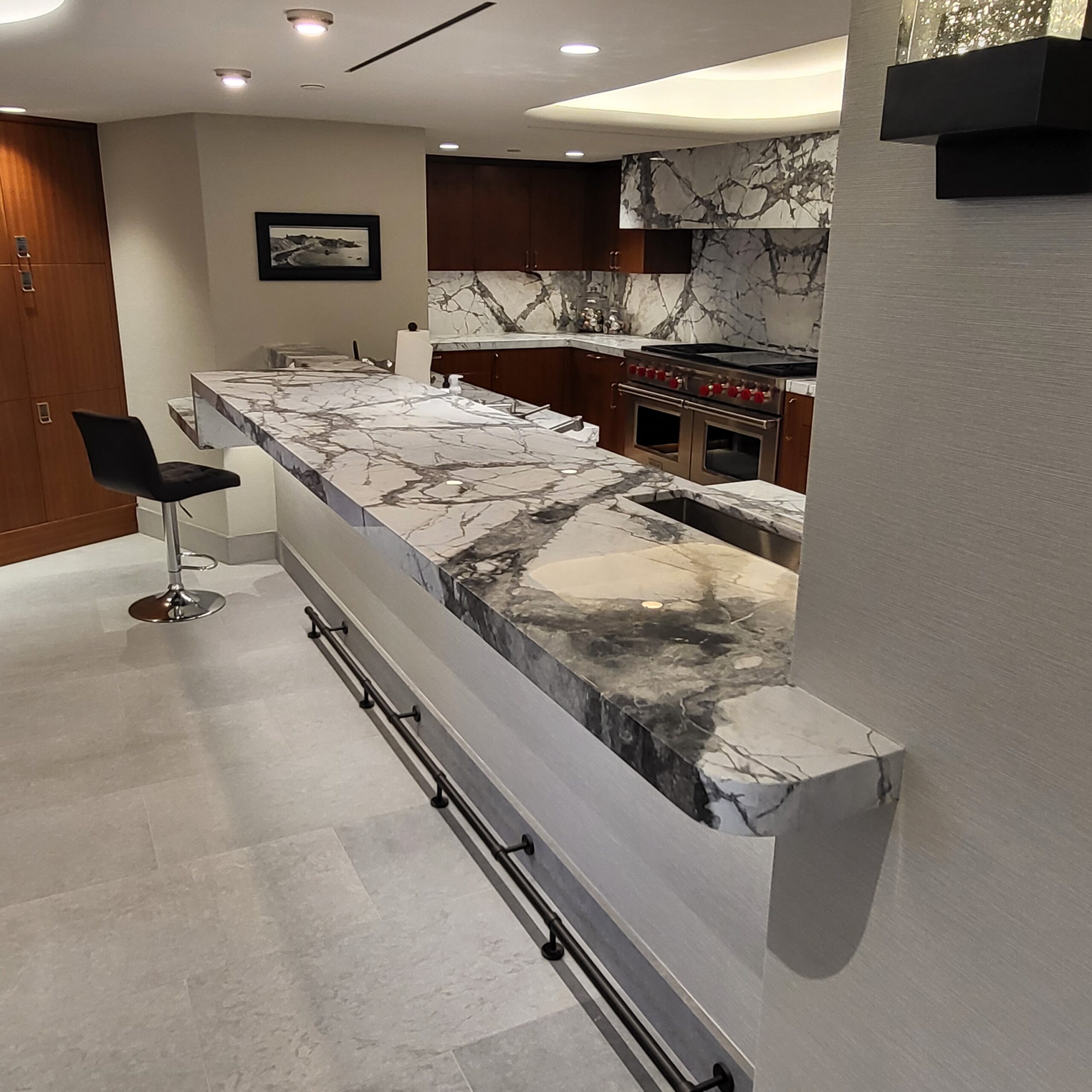 Sureshine technician applying MORE® AntiEtch® to a marble kitchen island in Summerlin, Nevada