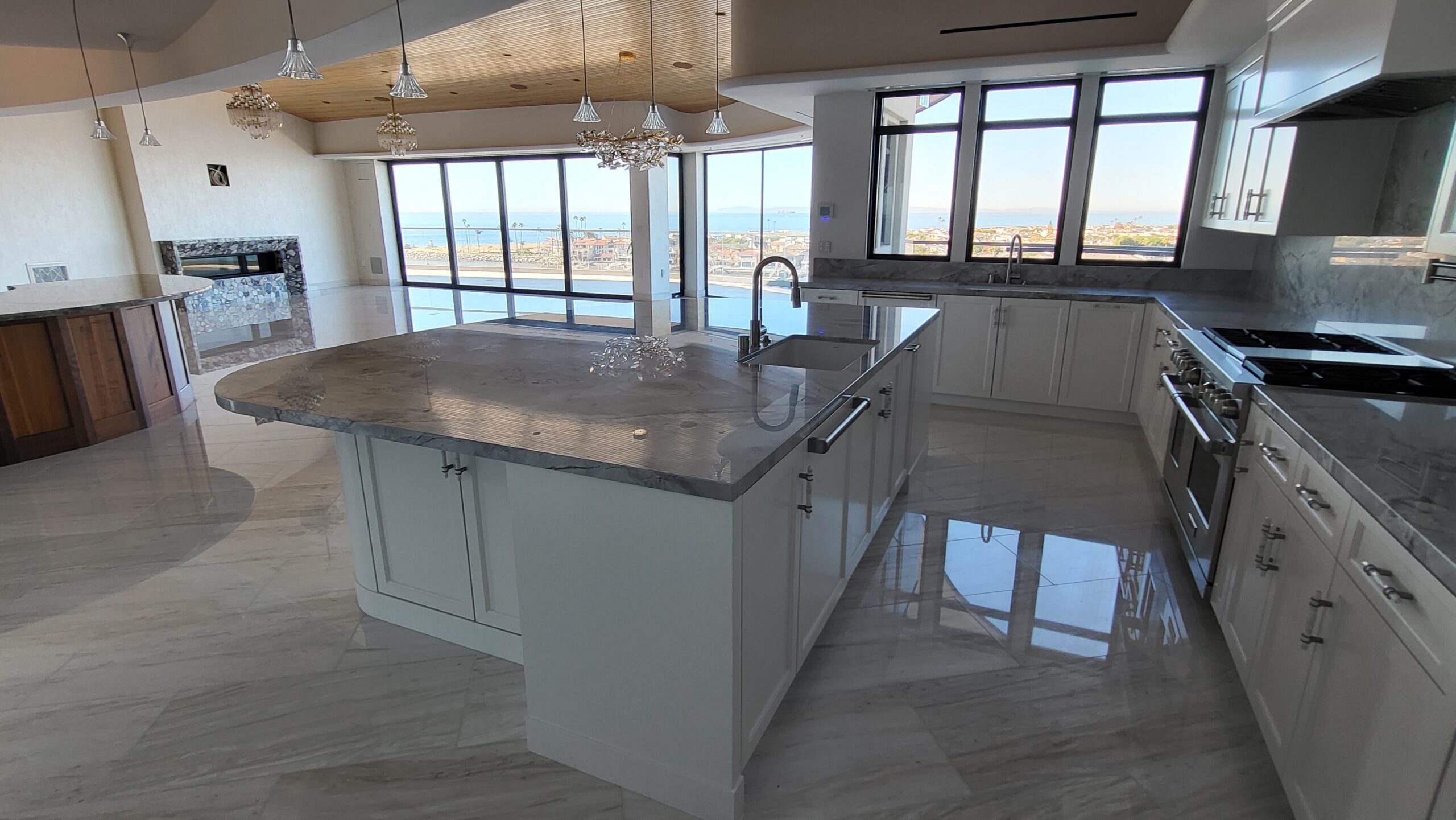 Marble floor refinished and polished by Sureshine Care and Restoration Services, Inc. in a Newport Beach home, showing restored shine and enhanced natural veining.