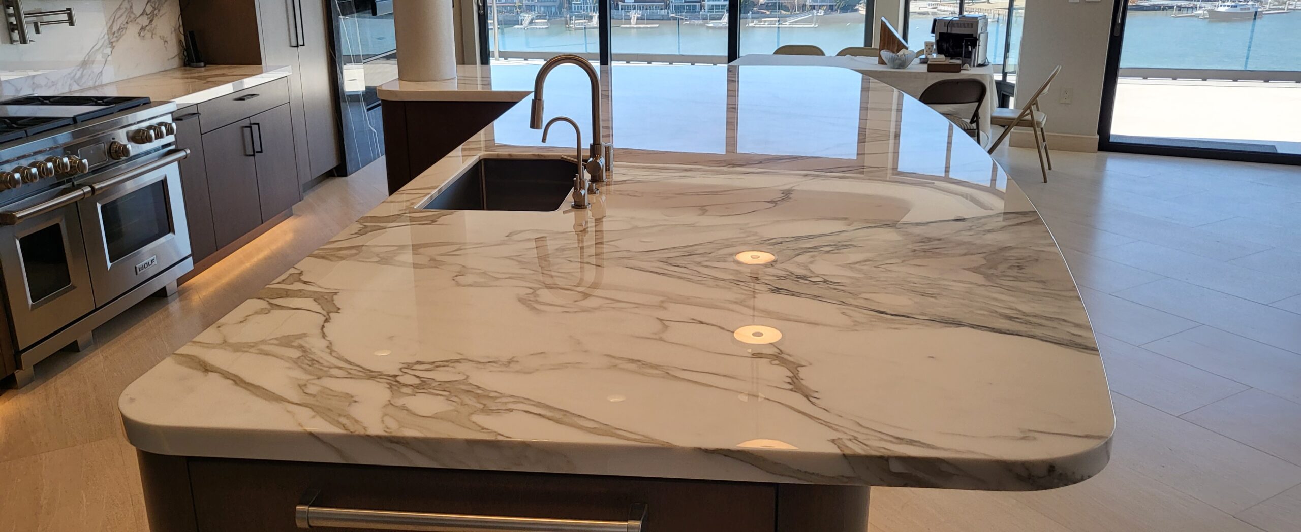 Crystal-clear AntiEtch® coating applied to a marble kitchen countertop in University Park, TX, showing a polished finish and natural veining