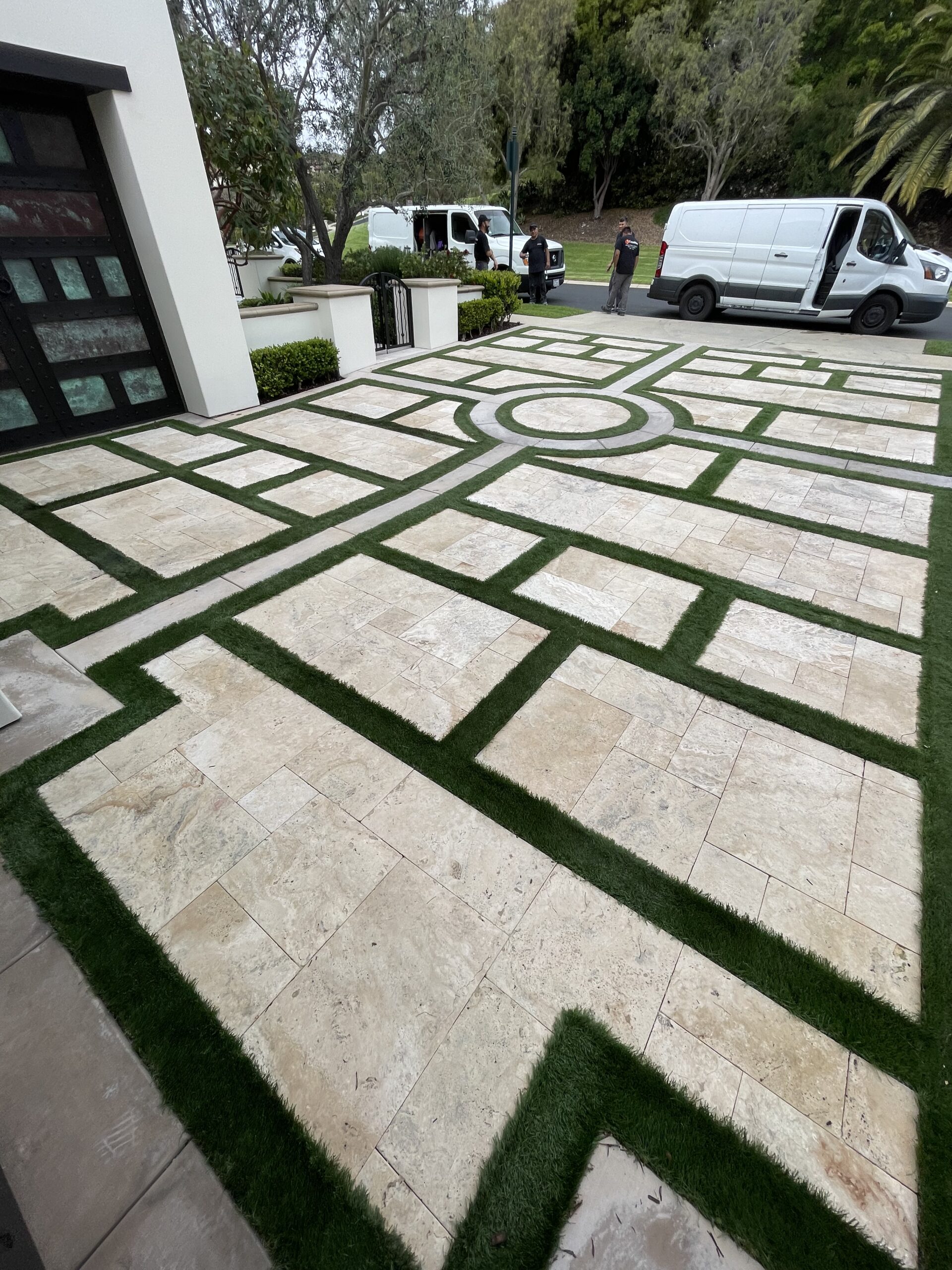Technician performing professional travertine cleaning and restoration on a stone floor, removing embedded dirt from pores and grout lines with specialized extraction equipment.
