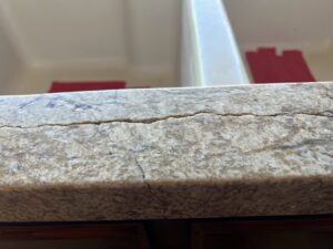 Granite countertop repaired by Sureshine Care and Restoration Services, Inc., showing a seamless finish after fixing a crack in a Los Angeles or Orange County home.