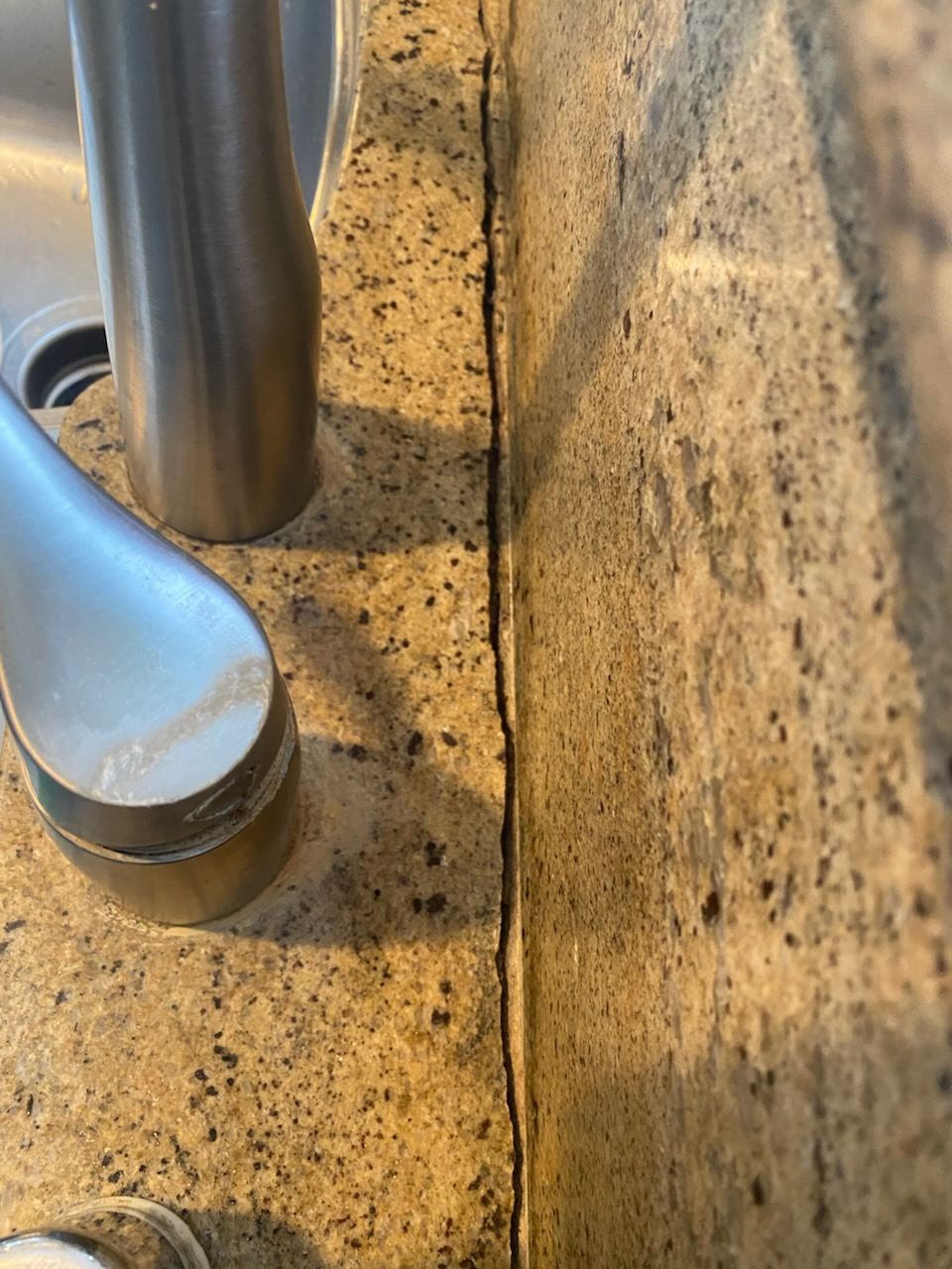 Granite crack repair in Beverly Hills CA showing countertop crack near sink before and after professional repair
