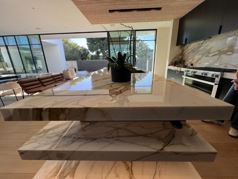 Before and after professional marble floor restoration in a Pacific Palisades California home showing improved clarity, consistency, and reflection.