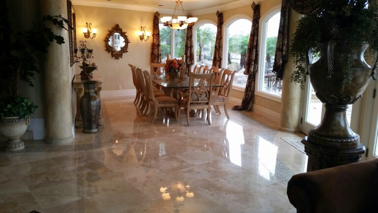 Before and after professional travertine floor cleaning and restoration in a Newport Beach California home showing cleaner grout and restored stone.